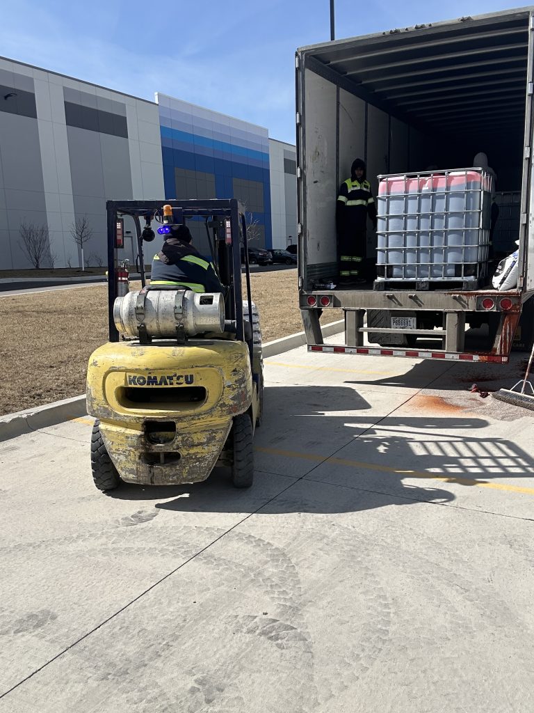 Unloading damaged freight for spill cleanup