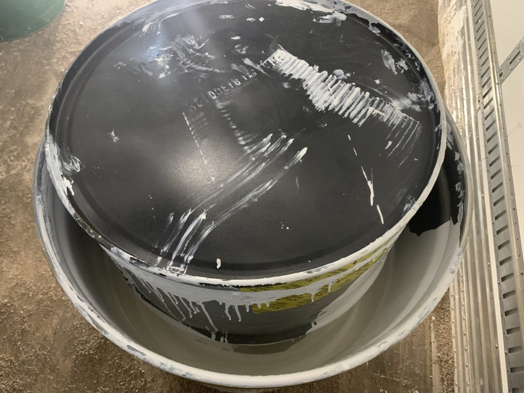 hazardous waste drum used during forklift accident at warehouse loading dock