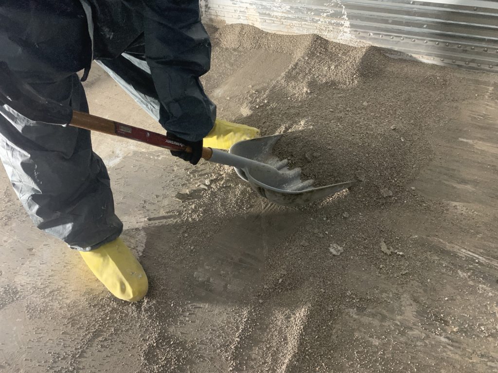 applying oil dry to a spill caused by a forklift accident