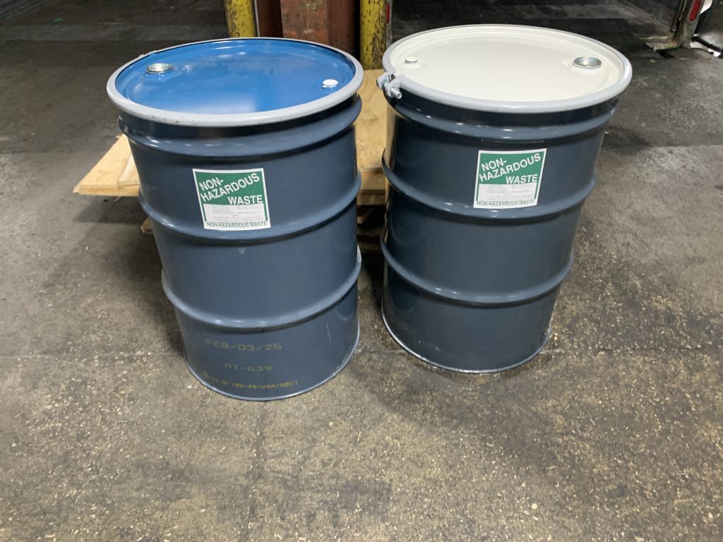 waste drums after spill containment approval